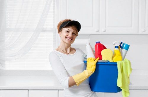 Tenant cleaning a kitchen at the end of tenancy
